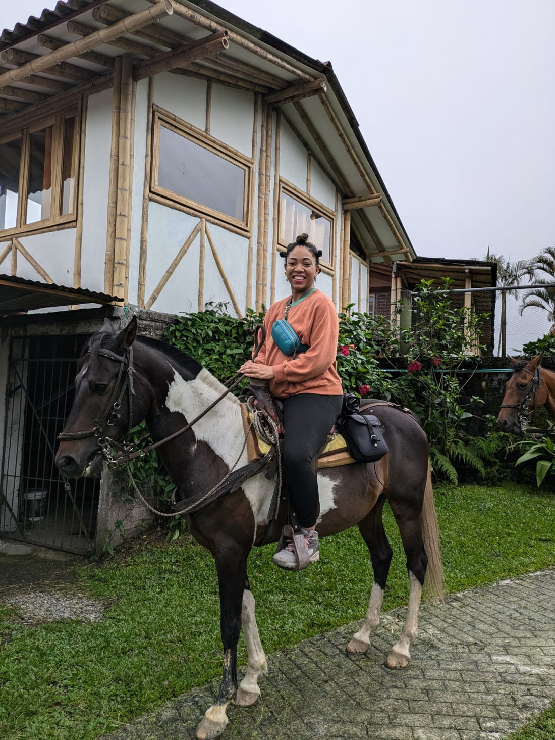 Sitting on a horse in Filandia Colombia on a yoga retreat